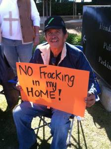 “No fracking in my home” reads the bright orange sign held by Javier Cruz as he and his fellow community members fast outside the Kern County Board of Supervisors office in Bakersfield, California.